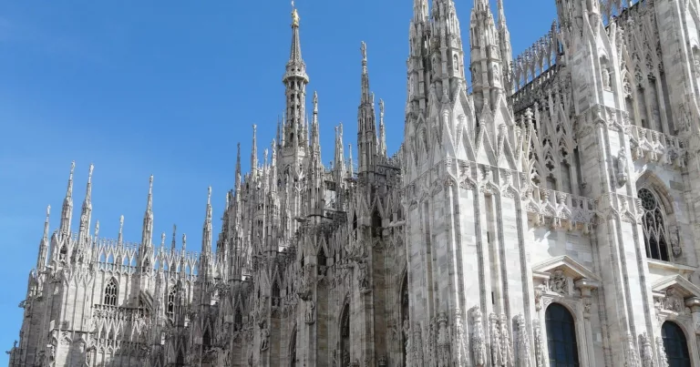 Stunning Milan Cathedral with Gothic spires under a clear blue sky
