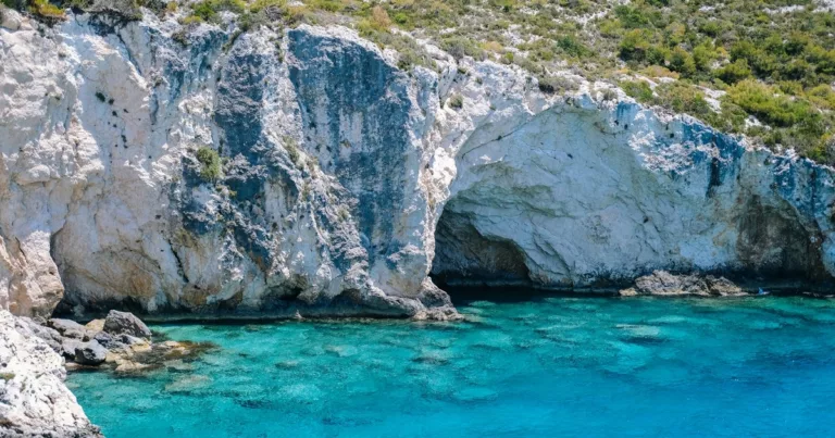 Crystal blue waters and limestone cliffs at the famous Blue Caves in Zakynthos Greece